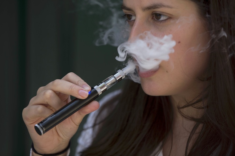 A woman smokes an electronic cigarette in London, Britain August 19, 2015. u00e2u20acu201du00c2u00a0Reuters pic
