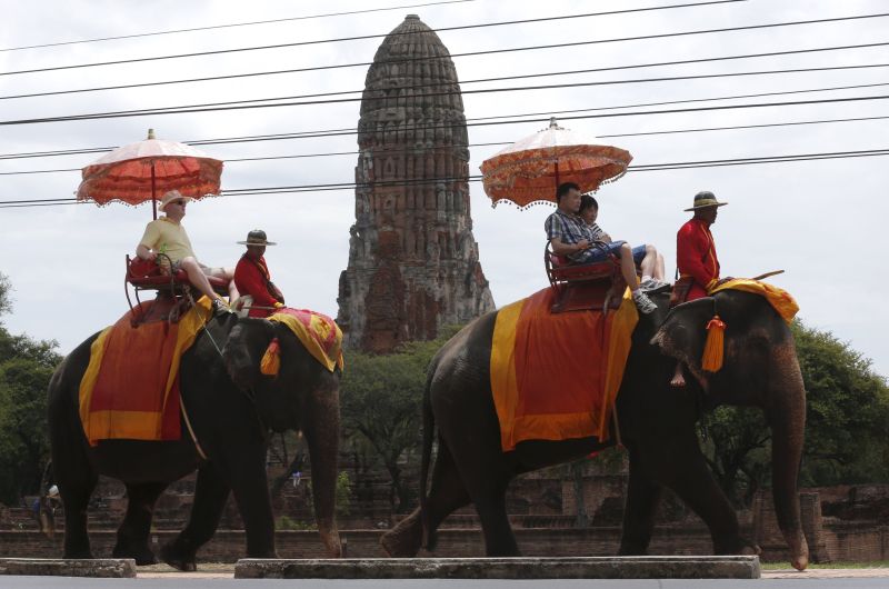 Tourists ride elephants in the ancient Thai capital Ayutthaya, north of Bangkok, Thailand, August 12, 2015. u00e2u20acu2022 Reuters pic