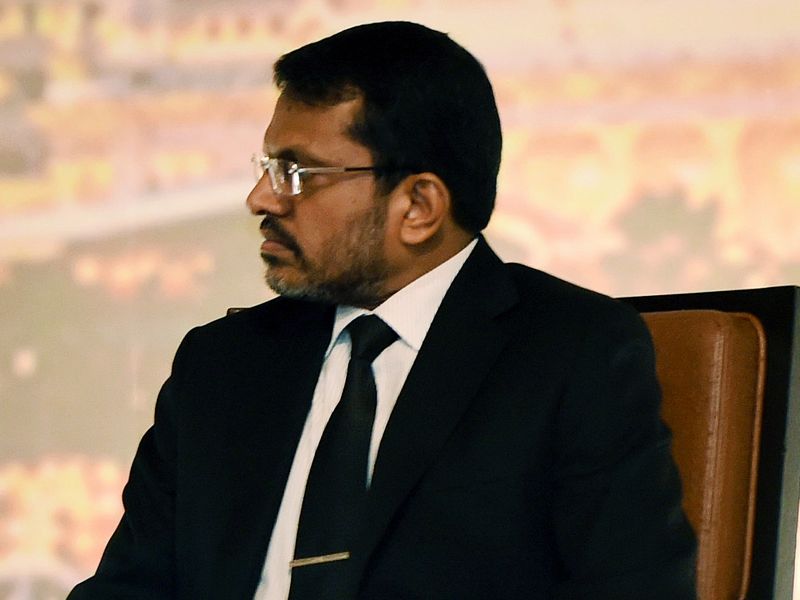 Monetary Authority of Singapore managing director Ravi Menon listens during a lecture organised by MAS on November 17, 2014 in Singapore. u00e2u20acu201d AFP pic 
