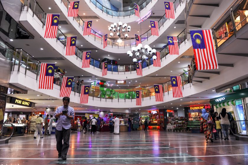 Malaysian national flags are seen hanging in a shopping mall ahead of the countryu00e2u20acu2122s independence day in Ampang on August 23, 2015. u00e2u20acu201d AFP pic