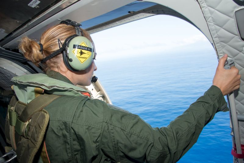 A French military transport crew member inspects the Indian Ocean during a search mission along the coast near Saint-Andre on the French island of Reunion on August 9, 2015. u00e2u20acu2022 Reuters pic