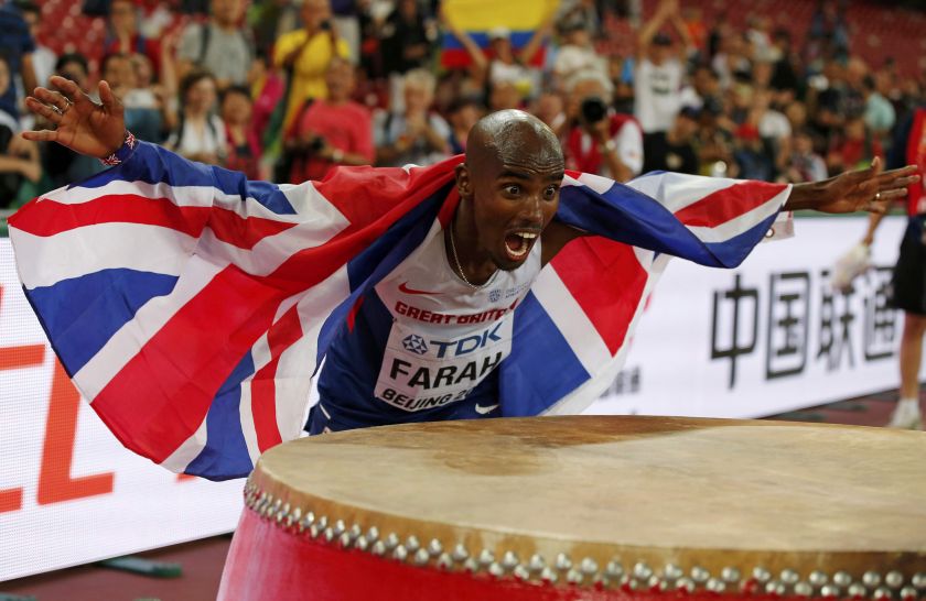 Mo Farah of Britain celebrates by playing a Chinese drum after winning the menu00e2u20acu2122s 10,000 metres final during the 15th IAAF World Championships at the National Stadium in Beijing, China August 22, 2015. u00e2u20acu201d Reuters pic
