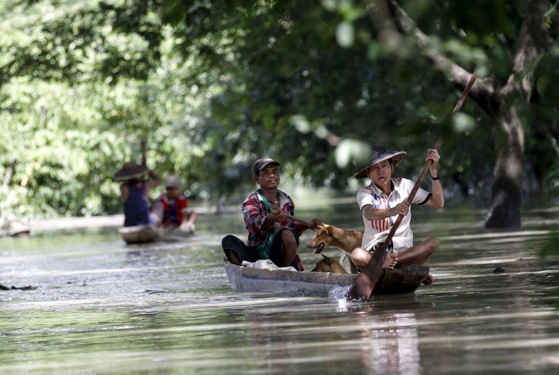 Men row boats on the flooded street in Kalay township at Sagaing division August 2, 2015. u00e2u20acu2022 Reuters pic