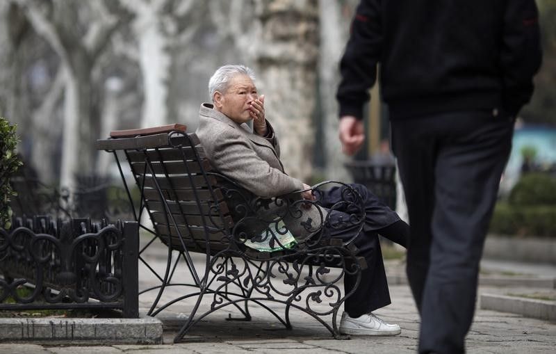 An elderly man sits at a park in Shanghai March 16, 2012. u00e2u20acu201d Reuters pic