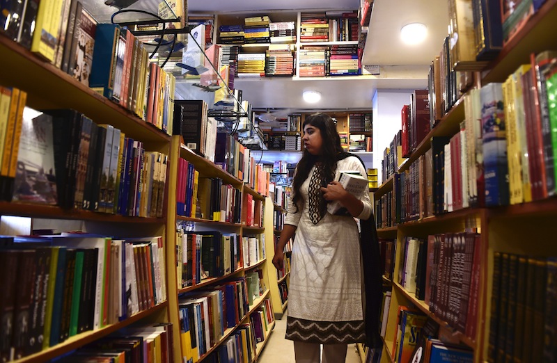 In this photo taken on August 9, 2015, Luavut Zahid, one of the Pakistani founders of the Khabaristan Times website, poses at a bookstore in Islamabad. u00e2u20acu201d AFP pic