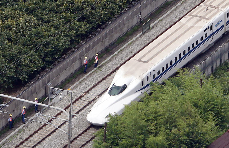 This aerial view shows a Nozomi 255 bullet train, or u00e2u20acu02dcshinkansenu00e2u20acu2122, stopped near the Odawara station on June 30, 2015 after an apparent suicide attempt on board. u00e2u20acu201d AFP pic