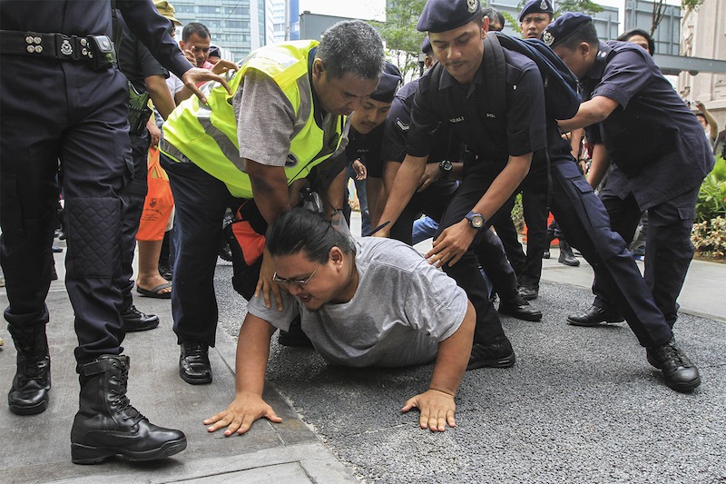 Protesters being arrested during #TangkapNajib rally at Sogo in Kuala Lumpur, August 1, 2015. u00e2u20acu201d Picture by Yusof Mat Isa 
