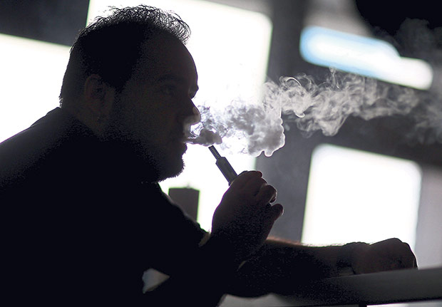 The National Fatwa Council has declared vaping and the use of e-cigarettes as haram for Muslims due to its purported detrimental health effects. — AFP pic