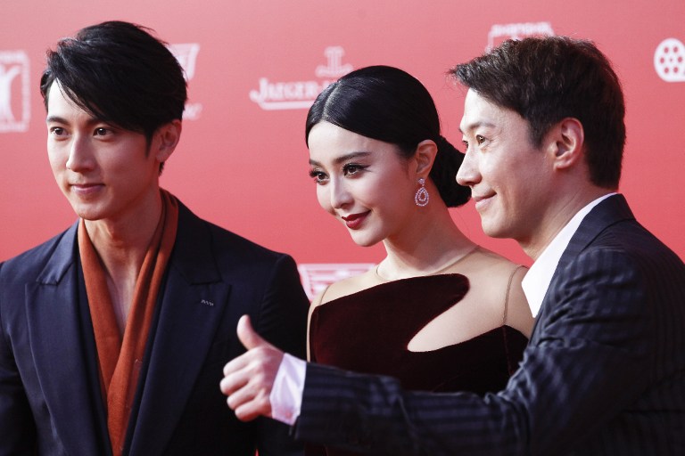 Taiwanese actor Wu Chun, Chinese actress Fan Bingbing and Hong Kong actor and Cantopop singer Leon Lai arriving on the red carpet for the opening ceremony of Shanghai International Film Festival in Shanghai June 13, 2015. u00e2u20acu201d AFP pic