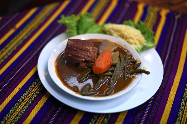 View of a plate with u00e2u20acu02dcPepian,u00e2u20acu2122 a traditional Guatemalan dish, in Guatemala City.  u00e2u20acu201d AFP pic