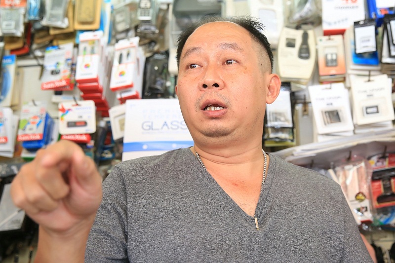 Mobile phone seller, Koh Hong Toong, was less optimistic about Dr Wan Azizah's role, saying there are no changes since she took over the constituency last year. — Picture by Saw Siow Feng