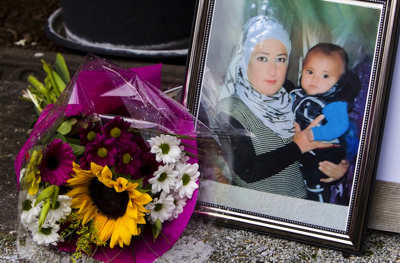 A photograph of Syrian woman Rehan Kurdi holding her son Aylan is pictured next to a bouquet of flowers outside the home of Rehan's sister-in-law Tima Kurdi in Coquitlam, British Columbia September 3, 2015.u00c2u00a0u00e2u20acu201d Reuters pic