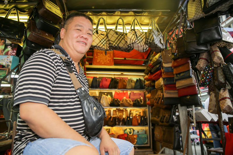 Bag trader Wong sitting in front of his shop of 30 years at Petaling Street, Kuala Lumpur, 25, Sept 2015, — Picture by Choo Choy May