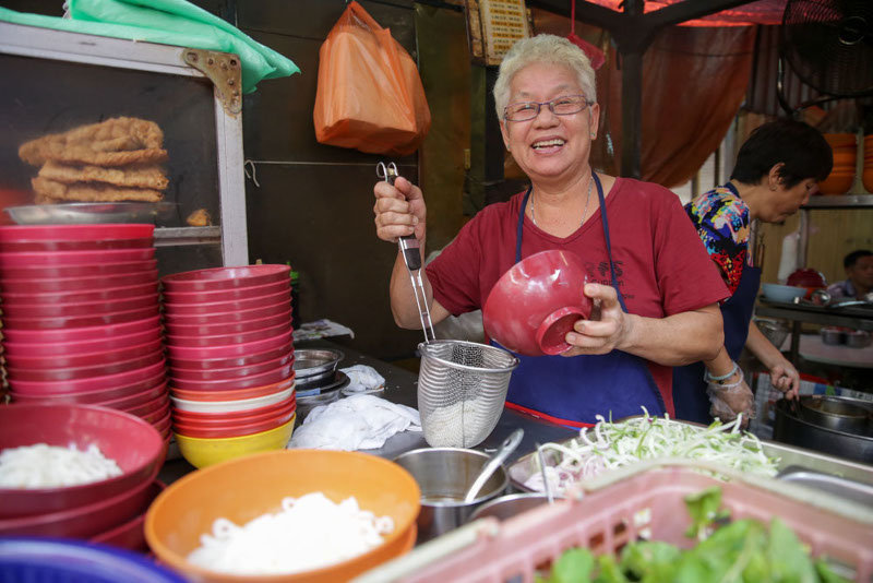 Curry noodle seller, Low Yoke Chan is seen in front of her stall at Petaling Street, Kuala Lumpur, 25, Sept 2015, — Picture by Choo Choy May