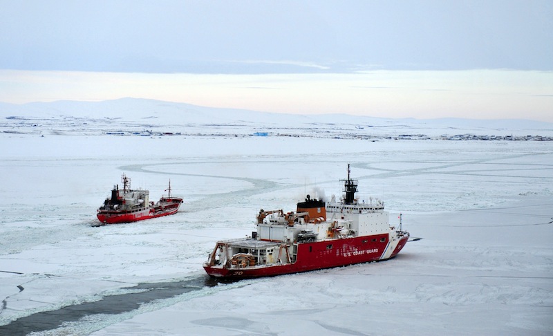 The Coast Guard Cutter Healy (right) breaks ice for the Russian tanker Renda near the city of Nome Alaska, seen in the distance, on January 14, 2012. u00e2u20acu201d AFP pic