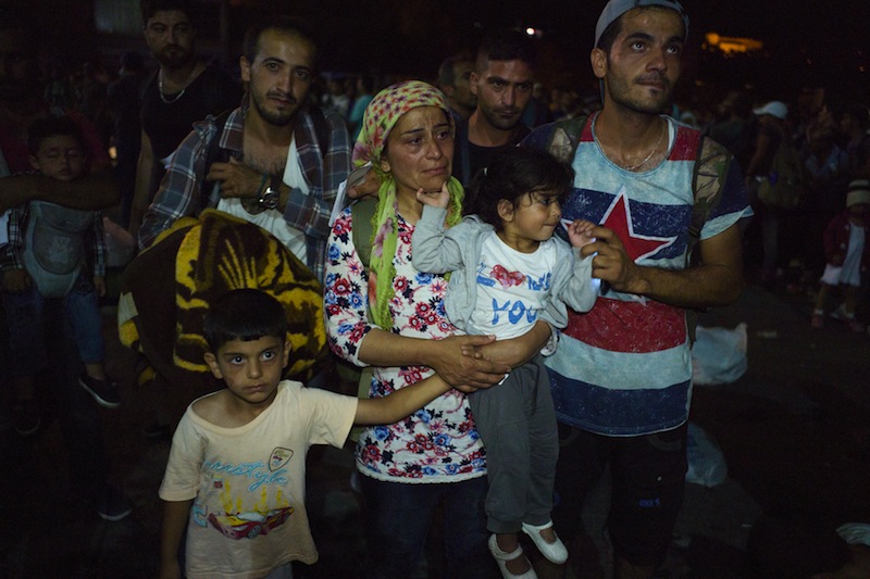 A Syrian refugee family wait to board the passenger ship Eleftherios Venizelos heading to the port of Piraeus, at the port on the island of Lesbos, Greece September 7, 2015.u00c2u00a0u00e2u20acu201du00c2u00a0Reuters pic