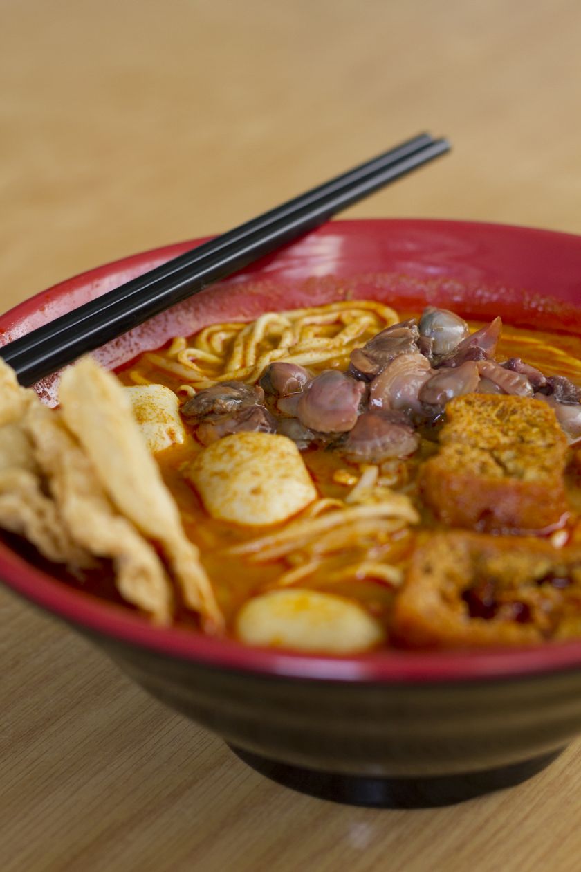 Aromatic curry laksa with bouncy fish balls, u00e2u20acu02dctaupoku00e2u20acu2122 (bean curd pouches), bean sprouts and succulent cockles. u00e2u20acu201d Picture by CK Lim   