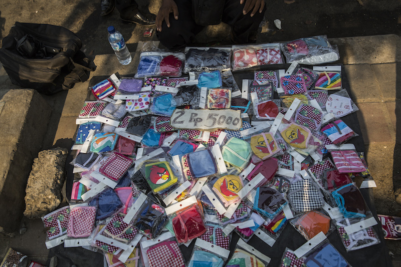A vendor displays masks on a sidewalk in Jakarta September 22, 2015. — Picture by Kemal Jufri/The New York Times