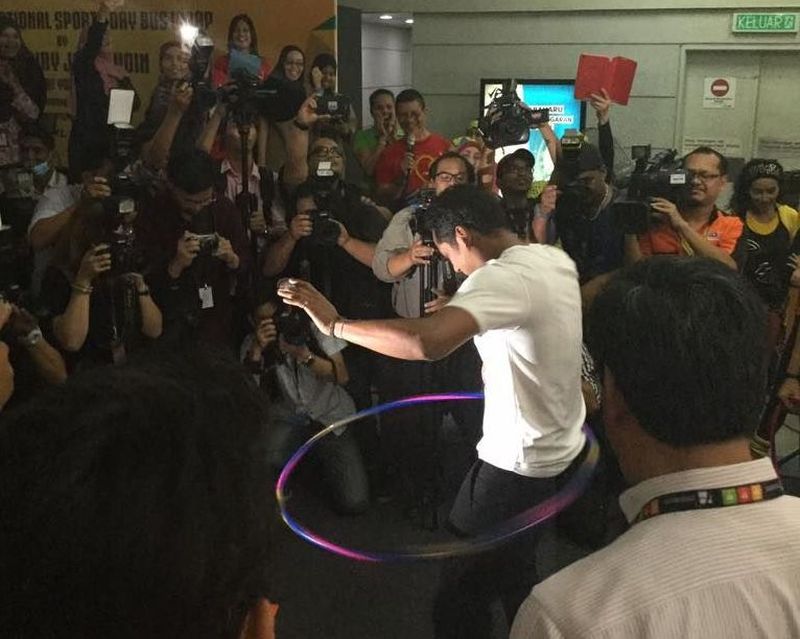 Minister of Youth and Sports Khairy Jamaluddin doing the hula hoop. u00e2u20acu2022 Picture taken from MyRapid Facebook page