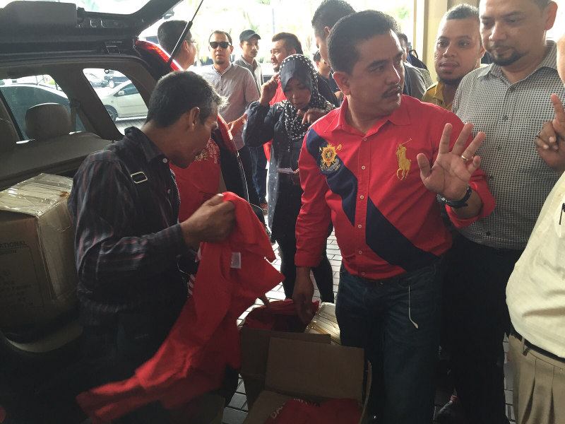 Organisers of the September 16 rally selling red T-shirts for RM10 each outside PWTC. u00e2u20acu201d Picture by Kamles Kumar