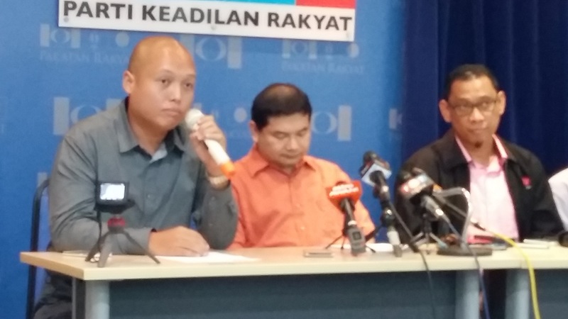 Loretto Padua Jr (left) announces his defection from Sabah BN to PKR today at PKR's national headquarters in Petaling Jaya, Selangor. u00e2u20acu201d Picture by Syed Jaymal Zahid