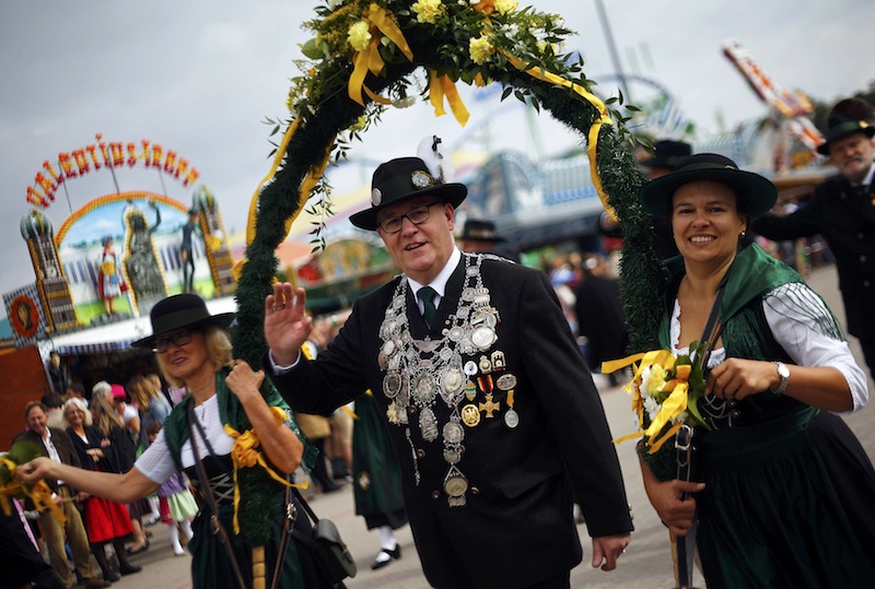 People dressed in traditional Bavarian clothes take part in the Oktoberfest parade in Munich, Germany, September 20, 2015. u00e2u20acu201d Reuters pic