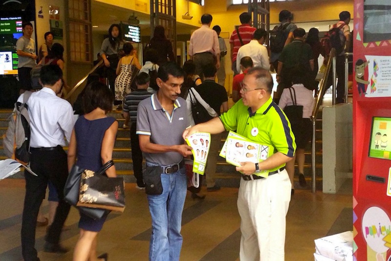 The SDAu00e2u20acu2122s Desmond Lim handing out his partyu00e2u20acu2122s flyers at Pasir Ris MRT Station yesterday during peak hour. Party candidates also gave heated speeches on the final night of the hustings. u00e2u20acu201du00c2u00a0TODAY pic