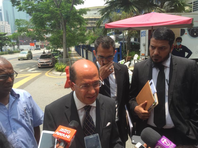 Khairuddin Abu Hassanu00e2u20acu2122s lawyer Stanley Augustin speaking to reporters outside Dang Wangi police station, Kuala Lumpur, September 19, 2015. u00e2u20acu201d Picture by Kamles Kumarn