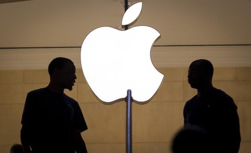 Customers stand beneath an Apple logo at the Apple store in Grand Central station in New York City, July 21, 2015.u00c2u00a0u00e2u20acu201d Reuters pic