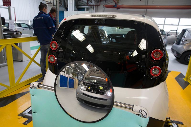 Employees work on the automobile assembly line of Bluecar electric city cars at Renault car maker factory in Dieppe, western France, September 1, 2015. u00e2u20acu201d Reuters pic