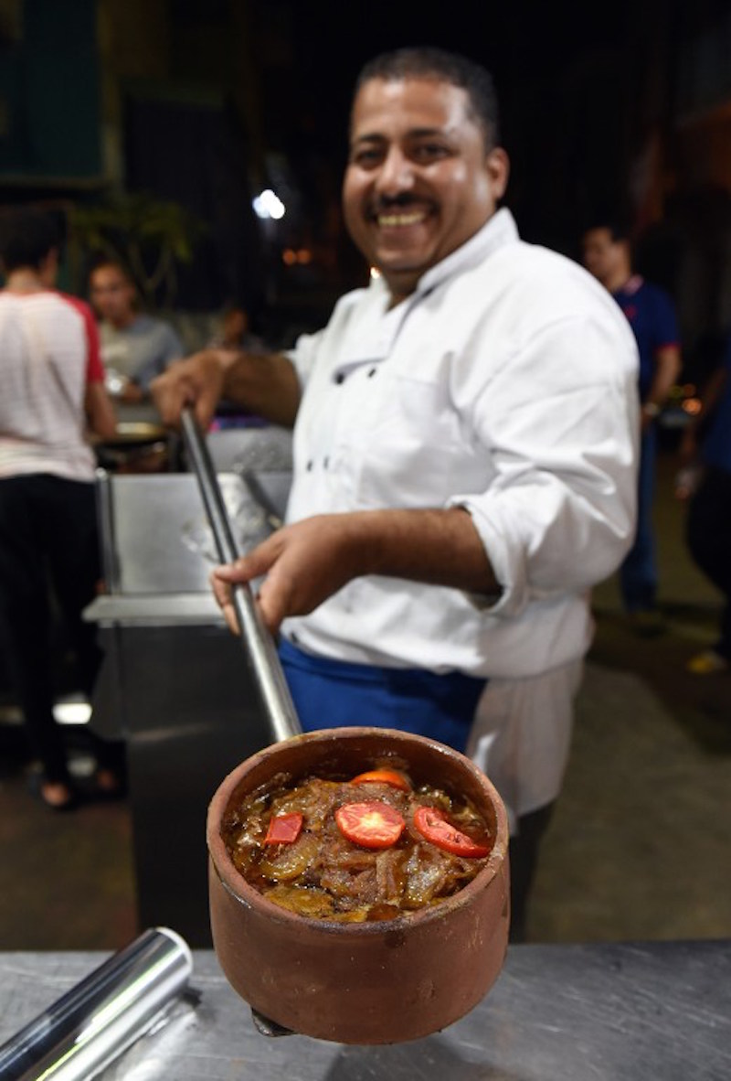 An Egyptian cook displays a dish at a restaurant in Cairo September 1, 2015. — AFP pic