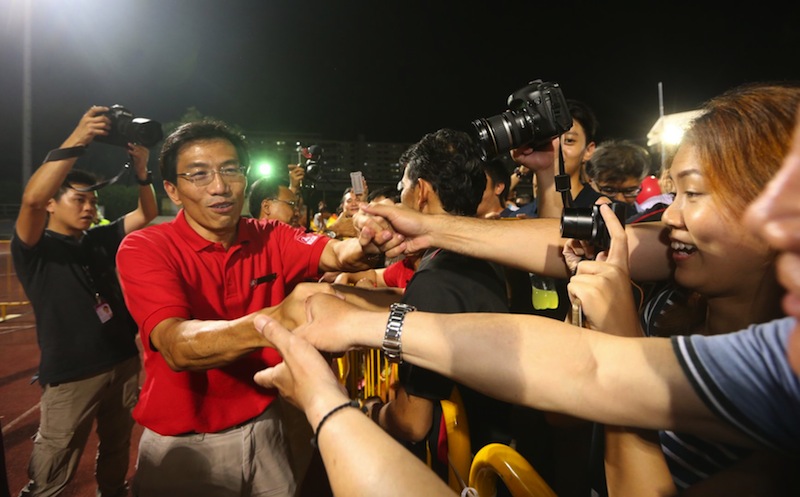 Dr Chee Soon Juan shaking hands with supporters following the end of the SDP rally for Marsiling-Yew Tee GRC at Woodlands Stadium on Sept 8. u00e2u20acu201d TODAY pic