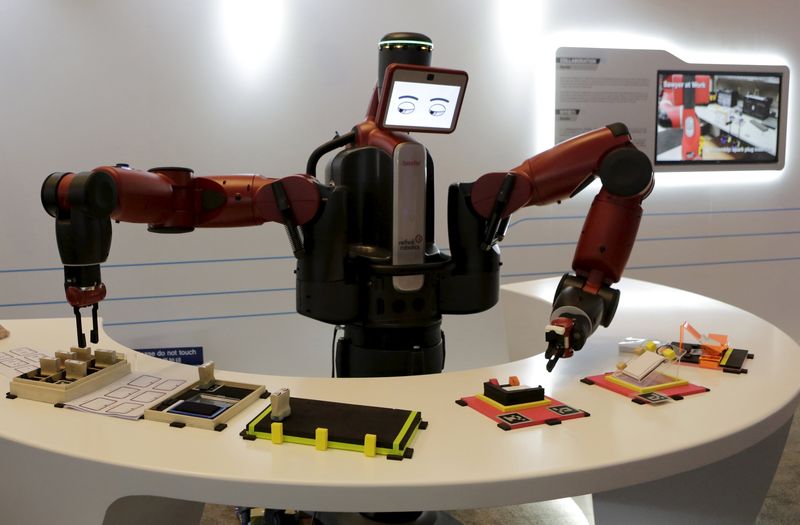 A Baxter robot of Rethink Robotics picks up a business card at the World Economic Forum (WEF), in Dalian, China, September 9, 2015. u00e2u20acu201d Reuters pic