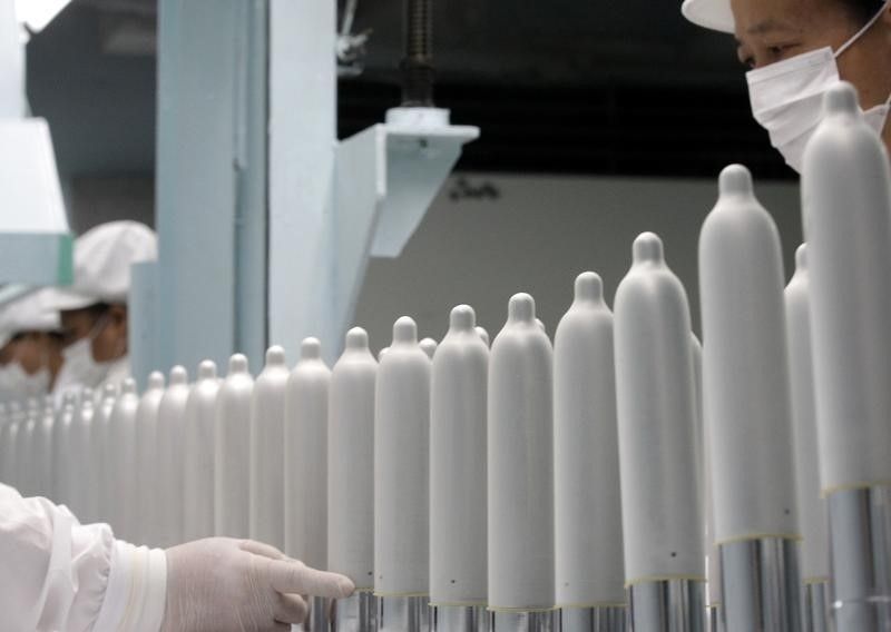 Employees work on the production line at the Taiwan Fuji Latex Condoms Discovery Centre in New Taipeh City July 24, 2013. u00e2u20acu201d Reuters pic 