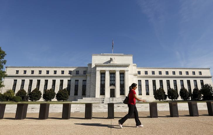 A woman walks past the Federal Reserve headquarters in Washington DC, September 16, 2015. u00e2u20acu201d Reuters pic