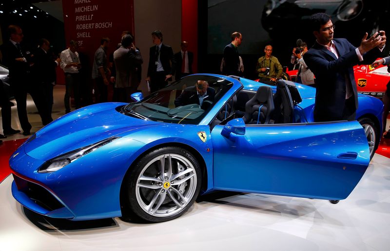 A visitor takes a selfie in front of a Ferrari car at the Frankfurt Motor Show in Frankfurt, September 15, 2015. u00e2u20acu201d Reuters pic 