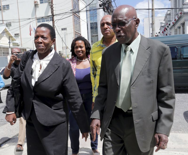 Former FIFA Vice-President Jack Warner (R) leaves the Magistrateu00e2u20acu2122s Court in Port-of-Spain with his lawyers September 25, 2015, after extraditions to the US. Case been adjourned until October 2, 2015. Reuters