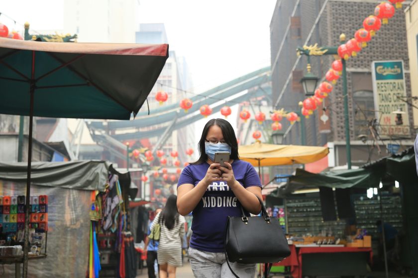 A customer is seen wearing a mask while walking on Petaling Street, Kuala Lumpur, September 26, 2015. u00e2u20acu201d Picture by Siow Saw Feng