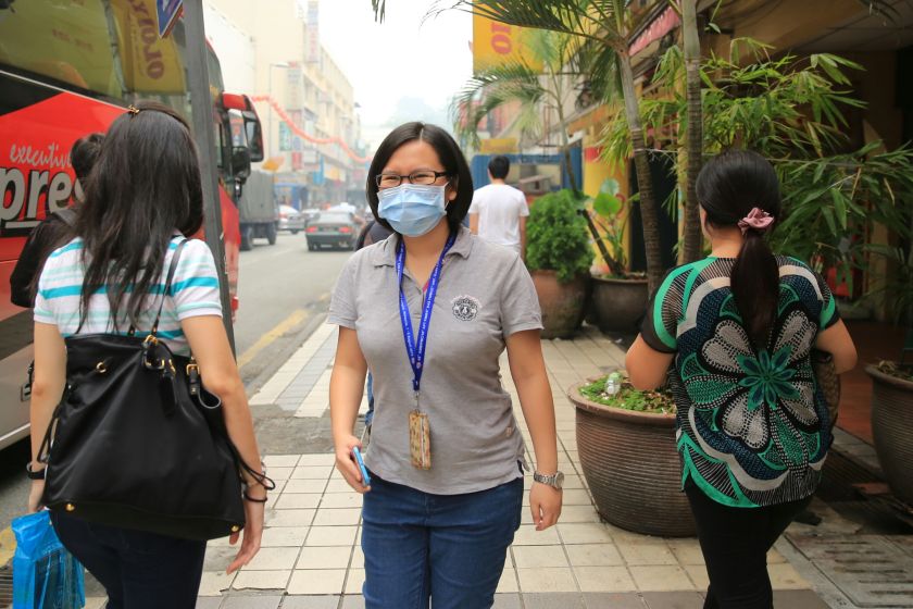 A shopper is seen wearing a mask on Petaling Street, Kuala Lumpur, September 26, 2015. u00e2u20acu201d Picture by Saw Siow Feng