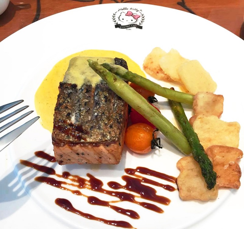 A delicious looking dish of Grilled Salmon with Asparagus, Cherry Tomatoes and Hello Kitty-shaped Potato Slices. — Picture courtesy of Sunway Pyramid