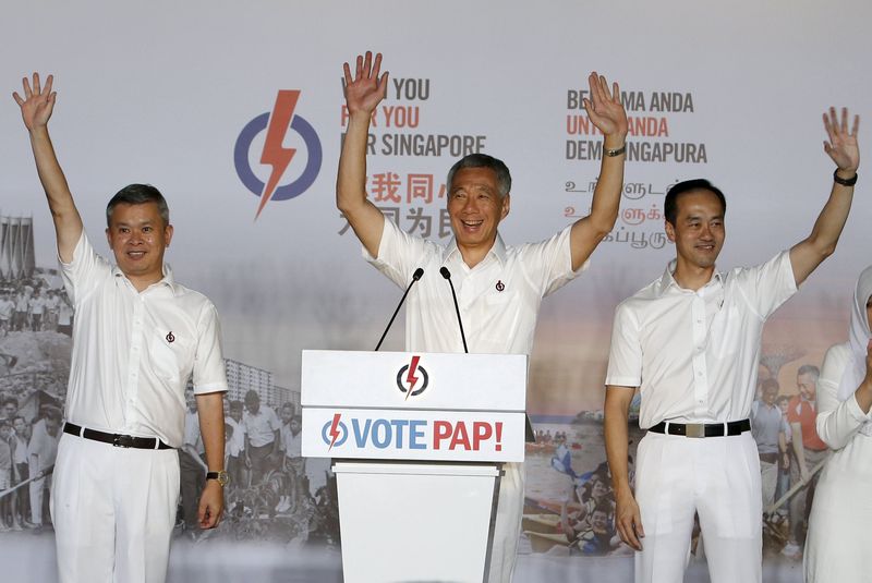 Singapore's Prime Minister Lee Hsien Loong (centre) thanks supporters with his team after the general election results at a stadium in Singapore September 12, 2015. u00e2u20acu201d Reuters pic
