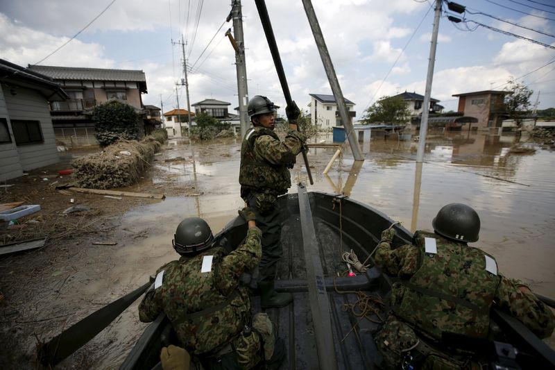 Japanese Self-Defence Force soldiers conducting a search and rescue operation at a flooded residential area in Araigi town in Joso, September 12, 2015. u00e2u20acu201d Reuters pic
