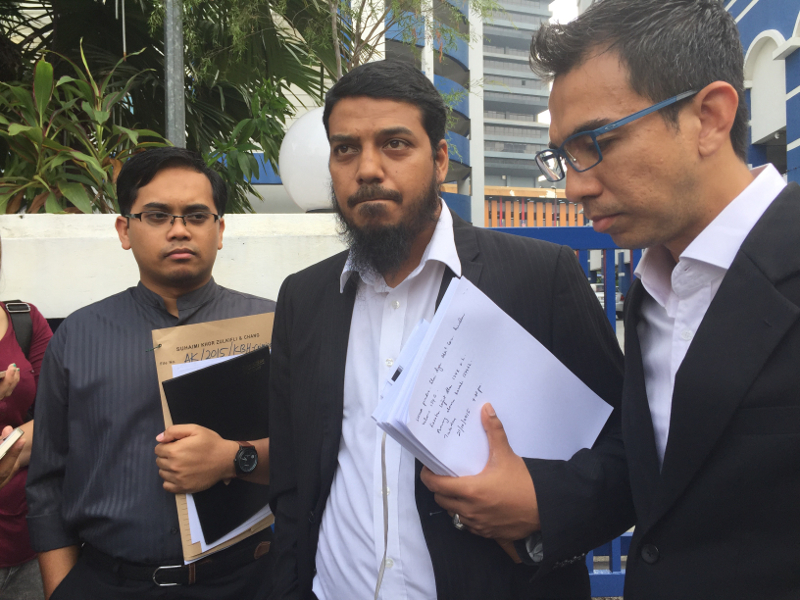 Khairuddin Abu Hassan's lawyers (From left) Muhammad Akmal Afiq, Muhammad Rafique Rashid Ali, Fahmi Abd Moin are seen outside the Dang Wangi police station, September 24, 2015. u00e2u20acu201d Picture by Aizyl Azlee