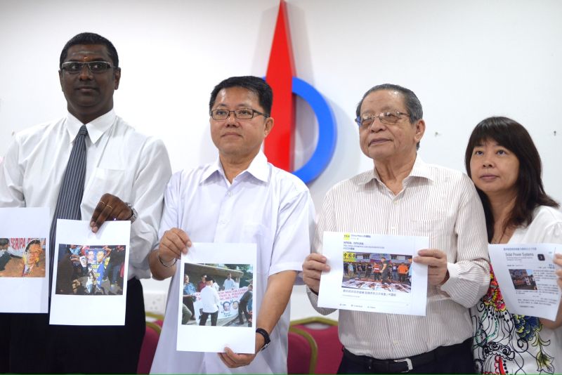 DAPu00e2u20acu2122s Lim Kit Siang (second right) condemned the action of stomping on photographs of political leaders, September 2, 2015. u00e2u20acu2022 Picture by K. E. Ooi