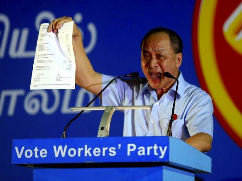 Workers' Party chief Low Thia Khiang holding up a copy of the audit form at the WP rally in Punggol on Sept 5, 2015. u00e2u20acu201d TODAY pic