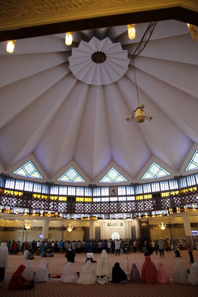 Muslims perform Friday prayers inside Masjid Negara.