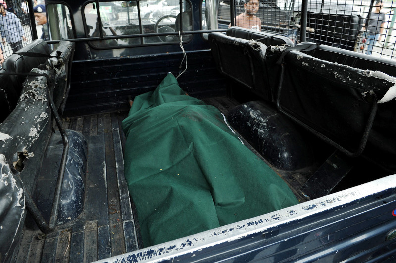 A body believed to that of the late Anthony Kevin Morais is placed in the back of a police truck. Police found it in a barrel of concrete in a swamp at Subang Jaya, Sept 16, 2015. u00e2u20acu201d Bernama pic