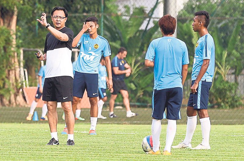 Newly appointed national football coach Datuk Ong Kim Swee (left) during a training session. u00e2u20acu201d File pic