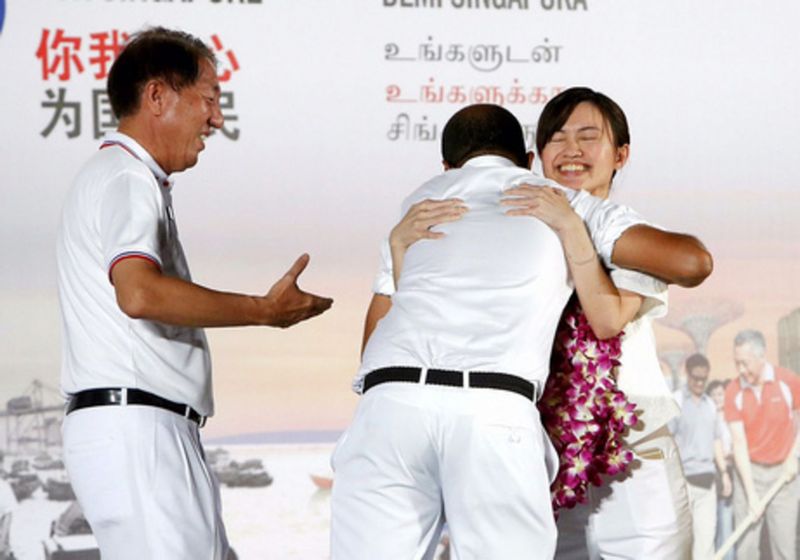 PAP candidate Tin Pei Ling (right) being congratulated by colleagues Janil Puthucheary and Deputy Prime Minister Teo Chee Hean after her win in MacPherson SMC. u00e2u20acu201d TODAY pic