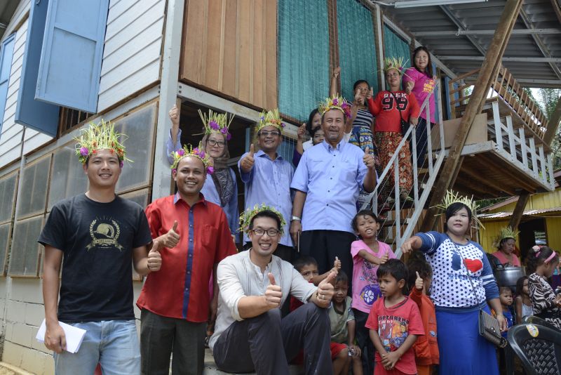 Three Orang Asli families at their new home with Nenggiri ADUN YB Mat Yusoff bin Ghani, Protasco representatives and EPIC representatives. 
